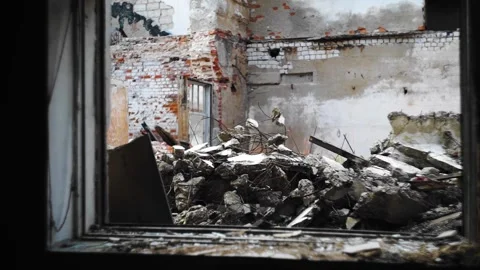 The building has been destroyed and there are concrete fragments Stock Footage 304997089