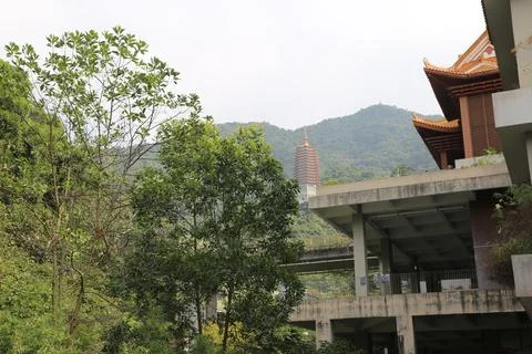 The building has a large statue on top of it Stock Photos