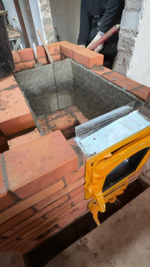 Building a heating stove, The bricklayer lays a brick, Checks the masonry w.. Stock Footage 321841179