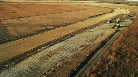 Building a highway through a field Stock Footage 44020597
