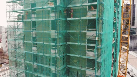 Building a house and a construction crane Stock Footage 88379082