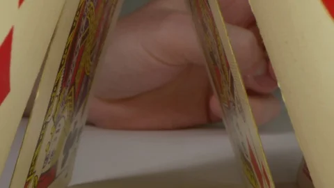 Building house of cards macro pull in shot. Macro slow motion using Laowa Vídeos de archivo 109259707