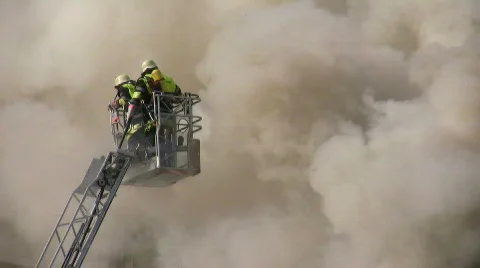 Building House Fire Smoke Flames Burning - Firefighter Tackles Blaze With A Hose Stock Footage