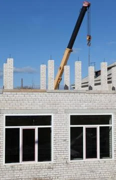 Building a house of gray bricks Stock Photos