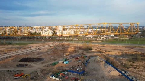 Building a house with a large construction crane. Construction crane against Stock Footage 219507202