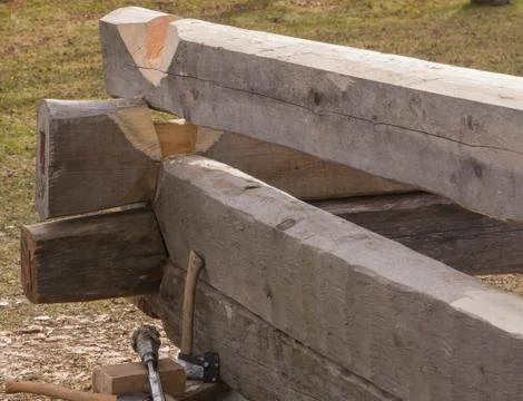 Building a house in old technology using knot timber Stock Photos