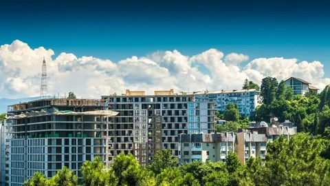 Building a house surrounded by trees and clouds time lapse Stock Footage 82188448