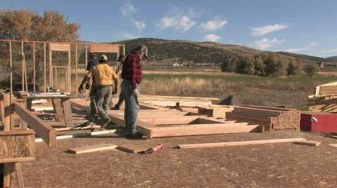 Building a house wall in a rural community carpenters Stock Footage