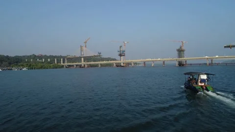 Building of a huge bridge over the river. Aerial view. Stock-Footage 85525998