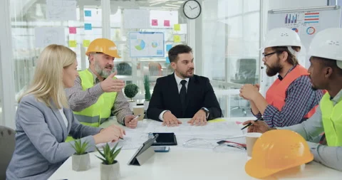 Building industry concept where attractive in good mood professional team of Stock Footage 145613329