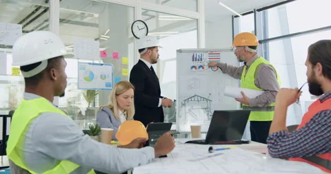 Building industry concept where good-looking bearded concentrated manager Stock Footage 145807786