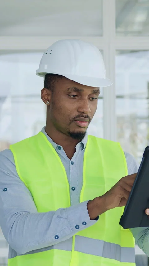 Building industry concept where good-looking serious experienced african america Stock Footage 327928949