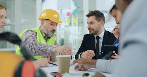 Building industry concept where handsome positive bearded boss and his female Stock Footage 145603930