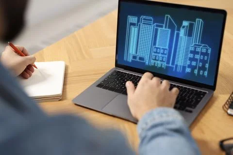 Building information modeling. Man working at laptop indoors, closeup. Digi.. Fotos de archivo
