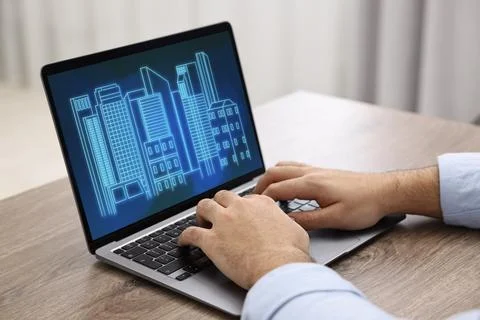 Building information modeling. Man working at laptop indoors, closeup. Digi.. Fotos de archivo