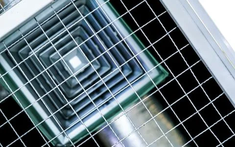 Building interior air conditioner on the ceiling with wire mesh Fotos de archivo