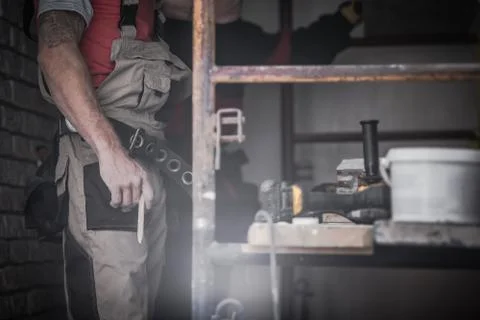Building Interior Remodeling Theme. Caucasian Contractor Worker with Wooden P Stock Photos