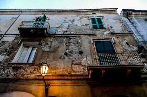 A building with a lamp on the side of it Stock Photos