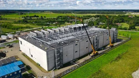 Building large data center facility with cranes and steel framework Stock Photos