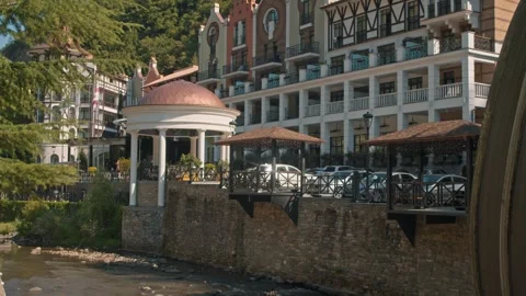 The building is a large hotel in the mountains surrounded by clean springs and Stock Footage 285176416