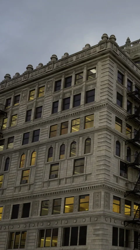 Building with large windows and an exterior fire escape in an urban area Stock Footage 334050520