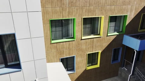 Building large windows offer views of surrounding cityscape Stock Footage 280914843