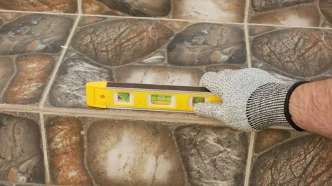 Building level. Home construction. The building level lies on the stairs. Stock Footage 154298913