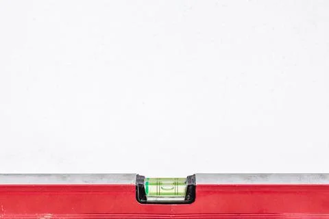 Building level on a white background, isolated with space for text. Stock Photos