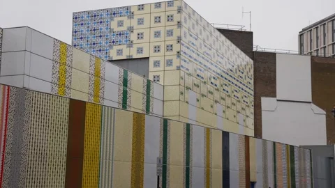 A building with a lot of different colored stripes on it Stock Footage 297859003
