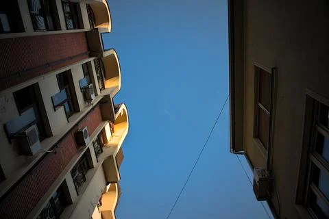 Building low angle with a blue sky above Stock Photos