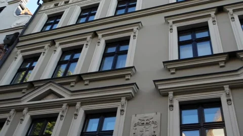 Building with many windows and a reflection of the sky.   Torun is city on .. Stock Footage 235900447