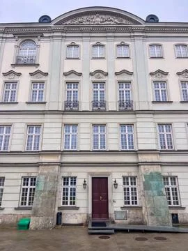 Building with many windows and a single door in Warsaw, Poland Stock Photos