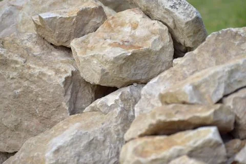 Building material stone. The light stone is straightened in a pile. Stock Photos