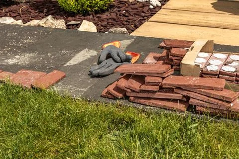 Building materials, bricks, mortar and tools for plastering and tiling plac.. Stock Photos