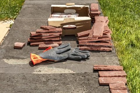 Building materials, bricks, mortar and tools for plastering and tiling plac.. Stock Photos