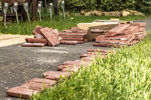 Building materials, bricks, mortar and tools for plastering and tiling plac.. Stock Photos