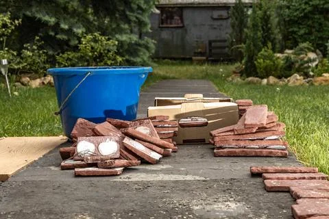 Building materials, bricks, mortar and tools for plastering and tiling plac.. Stock Photos