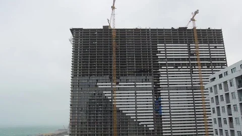 Building materials falls from construction site and crumble into small parts Stock Footage 118444968