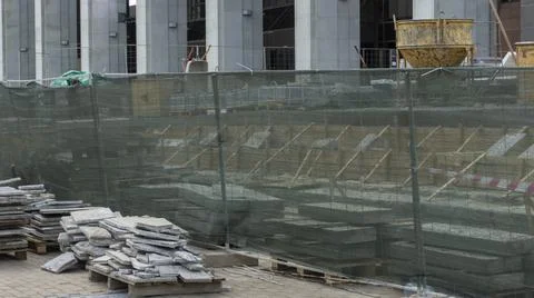 Building materials outside at the day. Construction work on a public street. Stock Photos