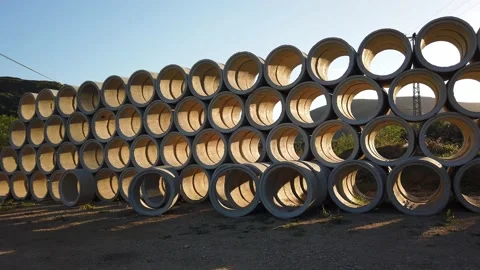 Building materials in packages, pallets stored in field at construction site. Stock Footage 136690206