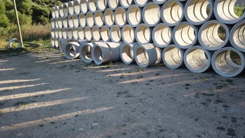 Building materials in packages, pallets stored in field at construction site. Stock Footage 136690216