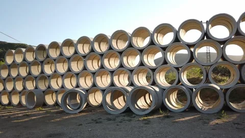 Building materials in packages, pallets stored in field at construction site. Stock Footage 136690222