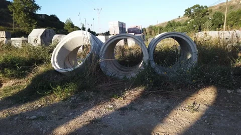 Building materials in packages, pallets stored in field at construction site. Stock Footage 136690227