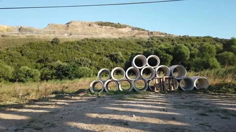 Building materials in packages, pallets stored in field at construction site. Stock Footage 136690234