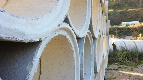 Building materials in packages, pallets stored in field at construction site Stock Footage 137959238