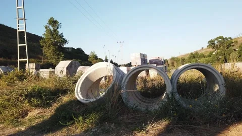 Building materials in packages, pallets stored in field at construction site Stock Footage 137959250