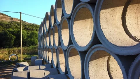 Building materials in packages, pallets stored in field at construction site Stock Footage 137959269