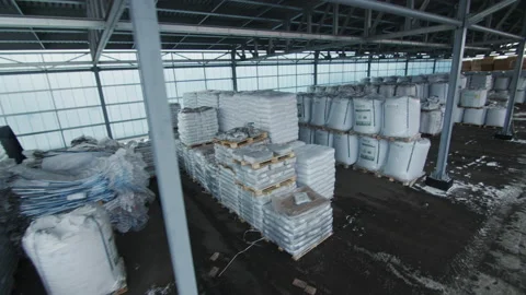 Building materials under lean-to in modern warehouse Stock Footage 231219079