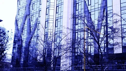 Building With Mirrored Walls In The Light Violet Sunset Stock Footage 104807295