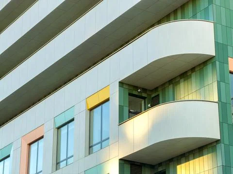 A building with a modern design. The structure features colorful panels and s Stock Photos